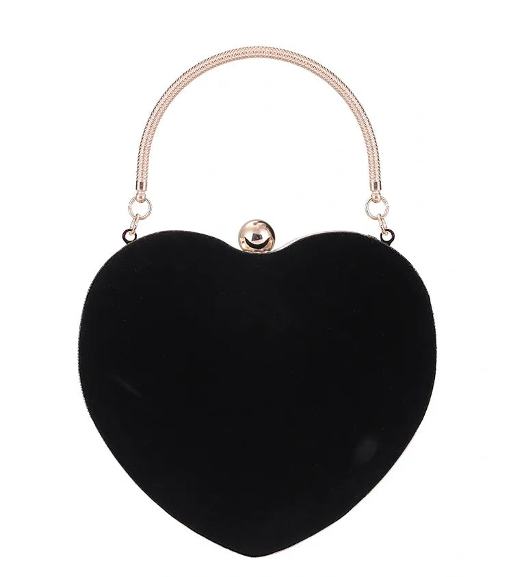 Black heart-shaped handbag with a handle on a white background